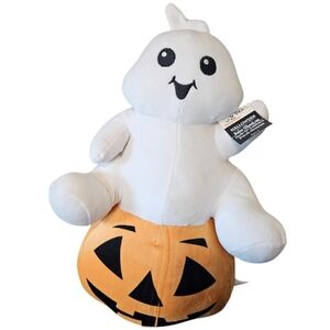Halloween ghost on pumpkin